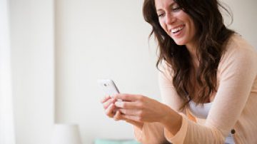 man holding cell phone New Silicone Phone Case Feels Like Human Skin...And Can Get Sunburned